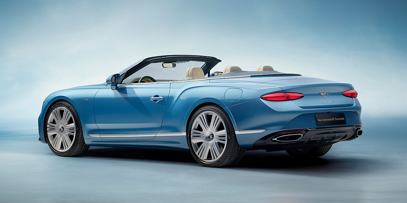 Bentley Kuwait New Bentley Continental GTC Azure convertible rear view in Light Windsor blue paint with 22 inch ten spoke wheels and chrome exterior details