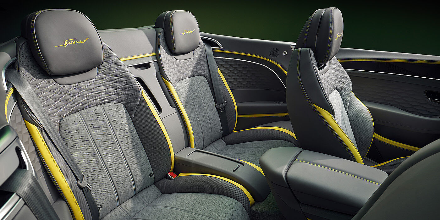 Bentley Kuwait Bentley New Continental GTC Speed convertible rear interior with unique Speed colour split in Gravity Grey and Cyber Yellow hide colours, and contrast stitched headrest emblems 