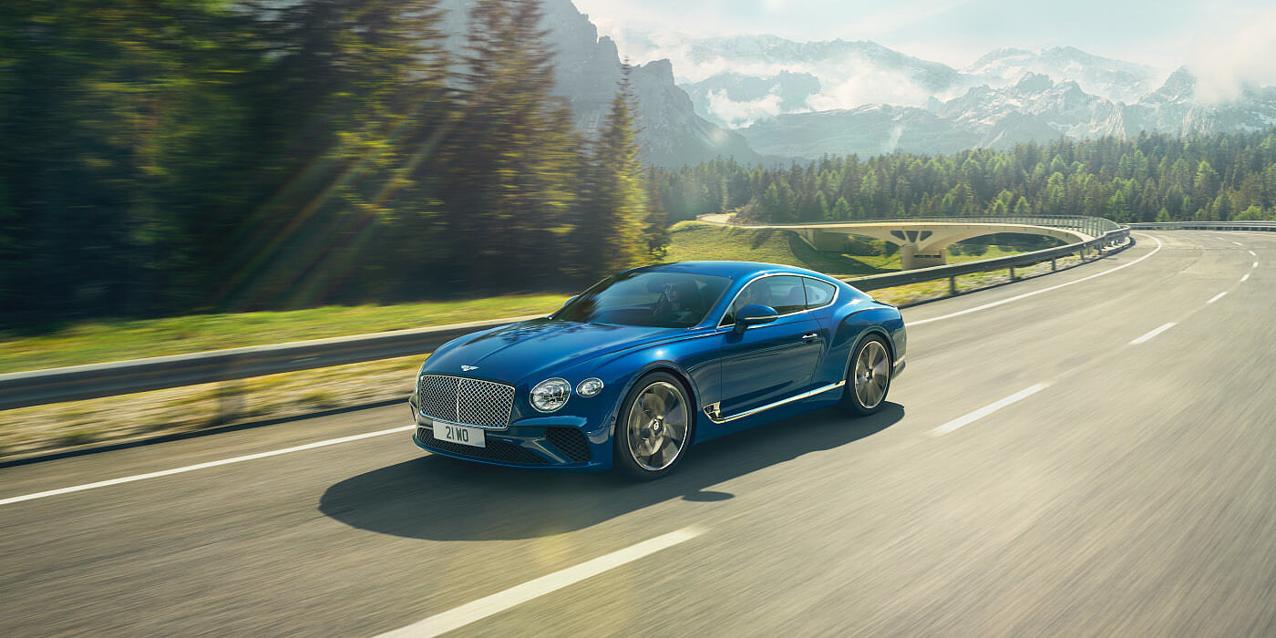 BENTLEY-CONTINENTAL-GT-IN-SEQUIN-BLUE-PAINT-ON-MOUNTAIN-ROAD