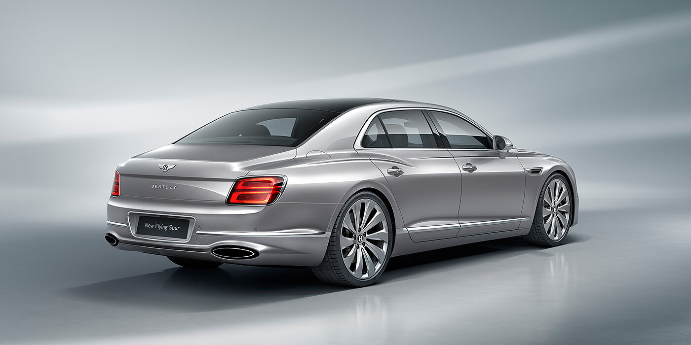 Bentley Kuwait New Bentley Flying Spur sedan rear view in Silverlake paint with ten spoke wheels and chrome matrix grille