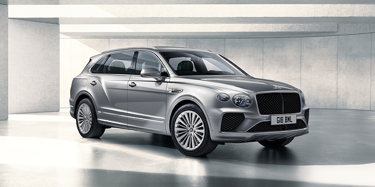 Bentley Kuwait Bentley Bentayga Extended Wheelbase SUV front three quarter in Moonbeam paint with a grey background