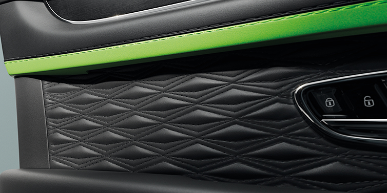 Bentley Kuwait Bentley Bentayga Speed SUV interior door detail with Diamond in Diamond stitched hide in Beluga black colour, with Black stained Crown Cut Walnut veneer