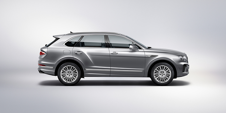 Bentley Kuwait Bentley Bentayga SUV side profile in Moonbeam silver paint against white background featuring 21 inch 5 spoke wheels