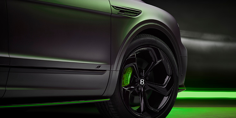 Bentley Kuwait Bentley Bentayga S Black Edition SUV exterior wheel detail with Cyber Green brakes with Anthracite Satin paint